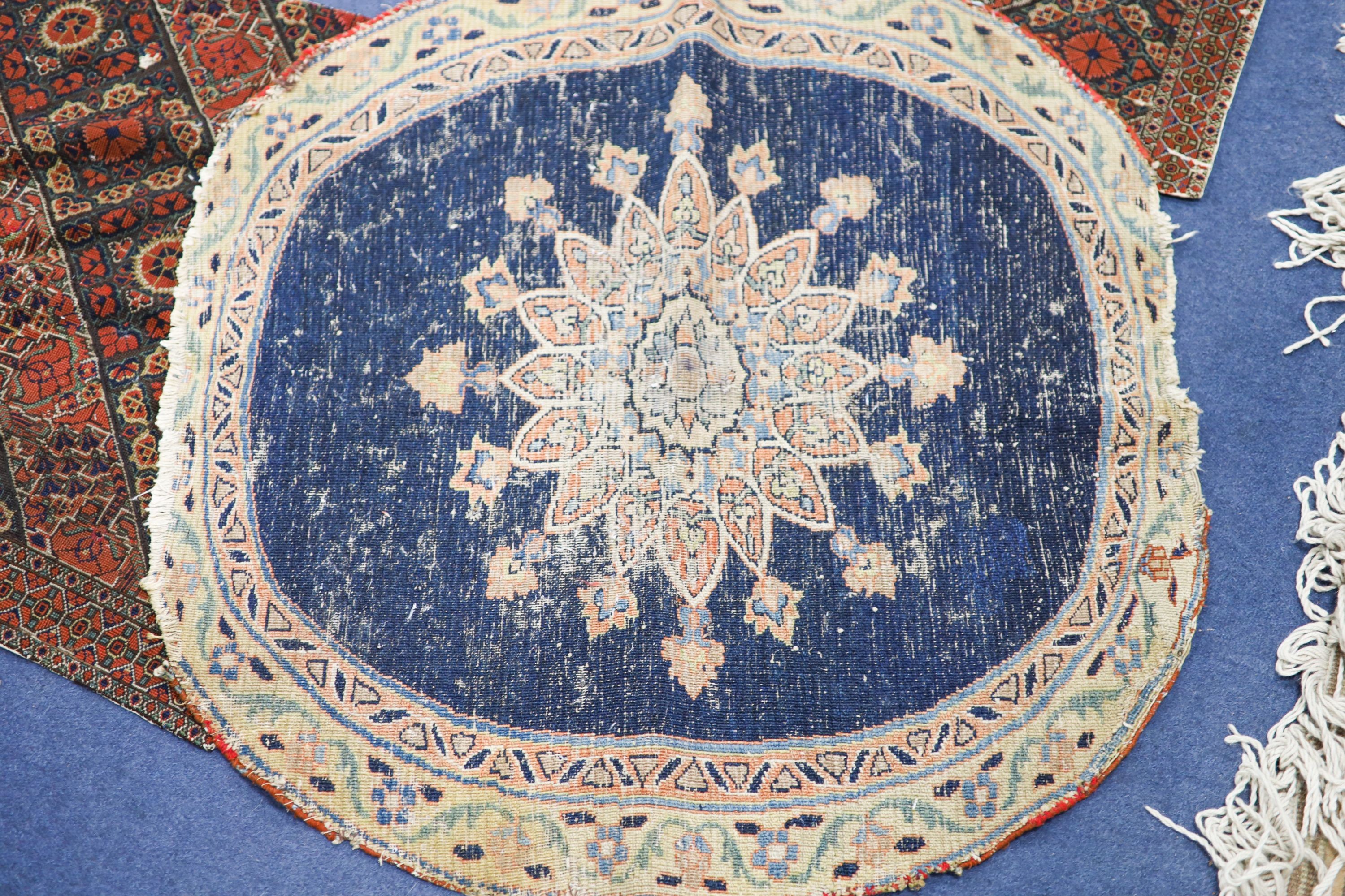 An Ottoman cross stitch embroidered cloth, 84 x 57cm., a pair of Persian antique needlework panels, 80 x 65cm. and a circular small rug, 86cm.